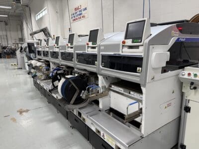 FUJI pick-and-place machines used for SMT component placement during PCB assembly.