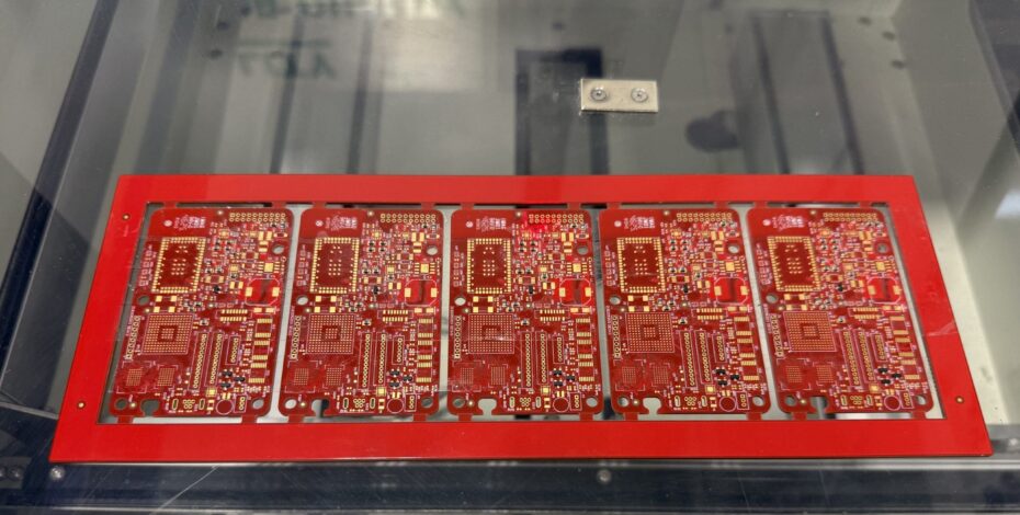 Finished PCB assemblies coming out of the oven.